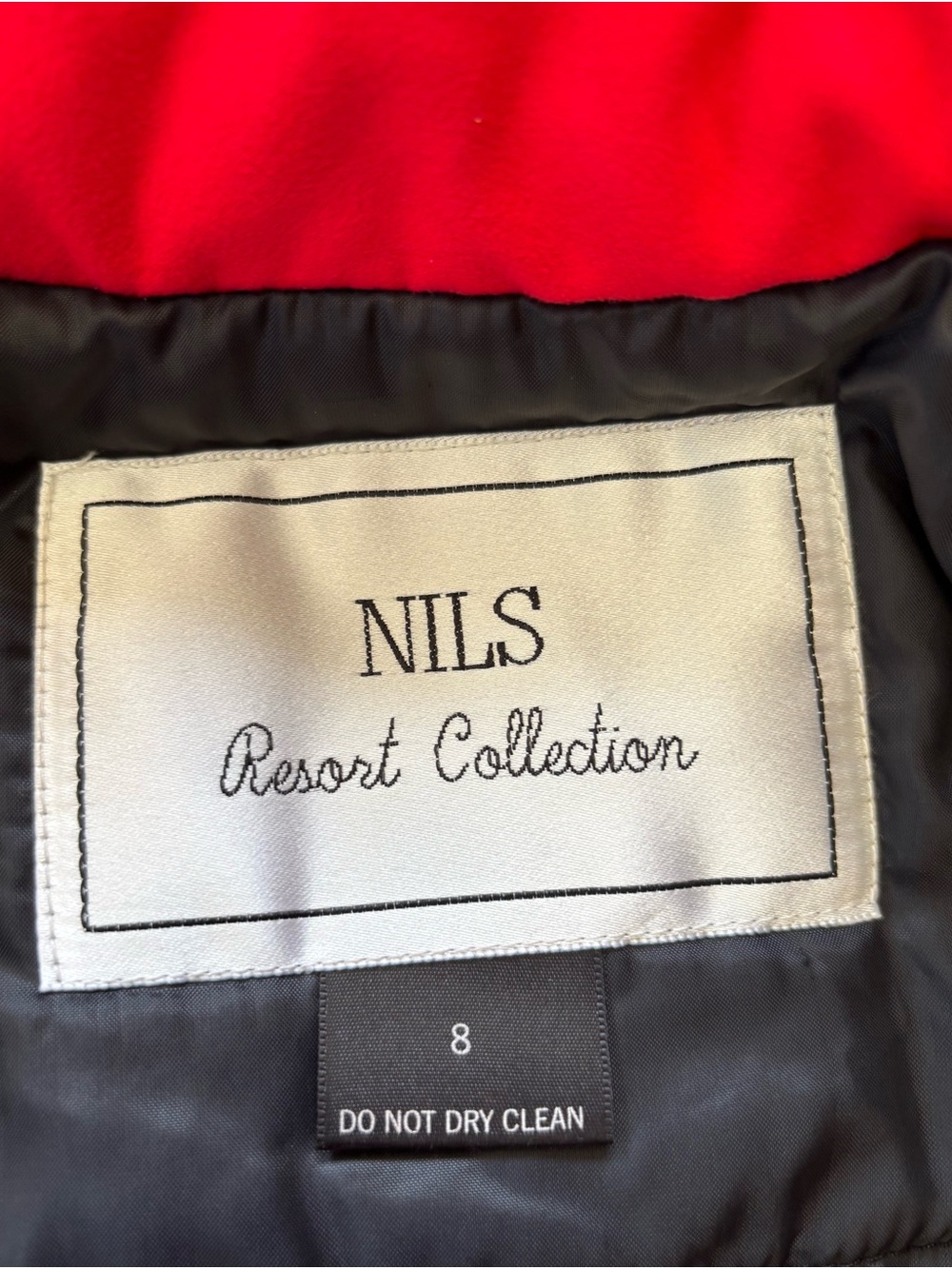 Women’s NILS Resort wear red with black fur trim with attached black stirrups